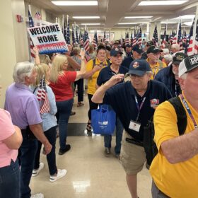 Veterans arrive to a hero’s welcome. Photo submitted.