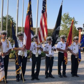 The Polk County Memorial Guard prepares to present the colors for the Grand Prix show jumping event at the Tryon International Equestrian Center, July 16. From left to right: Curtis Pike, Commander Micheal Collins, John Thurow, Paul Stout, Scott Weichl, Ken Martin. Photo by Catherine Hunter.