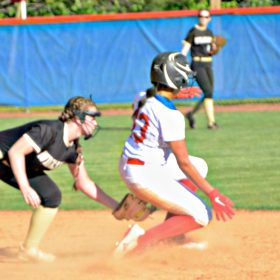 Leadoff hitter LaShea Morlu (13) and other softball Falcons are aggressive on the bases. They upset Franklin. Photo by Pete Zamplas.